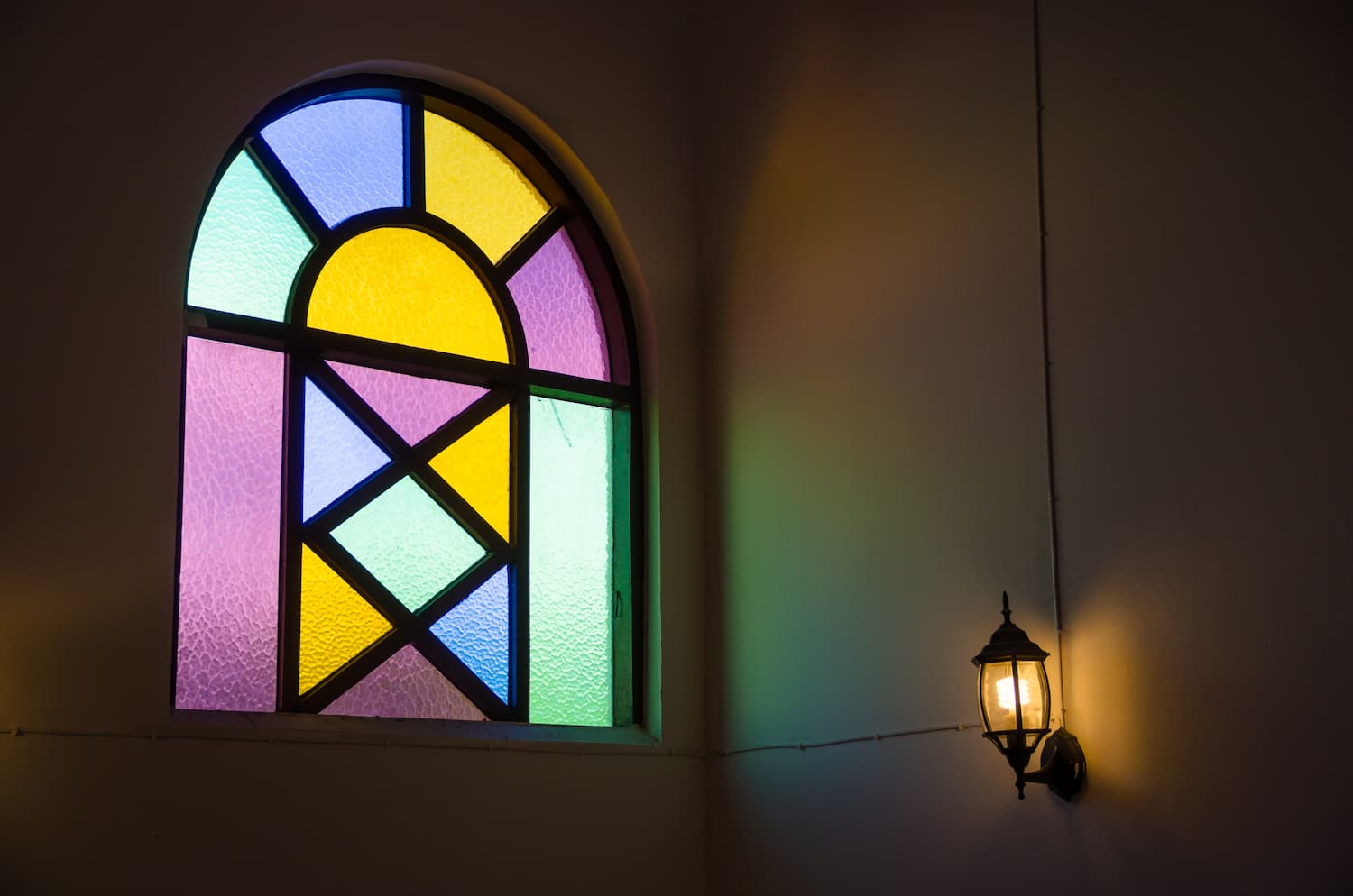 colorful-glass-window-with-lamp-light-wall