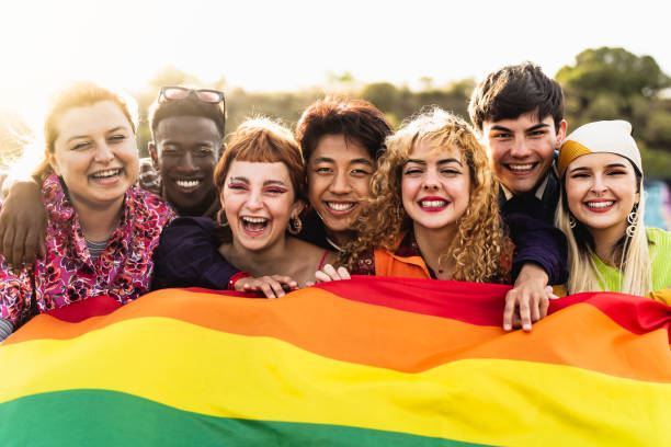 Diverse young friends celebrating gay pride festival - LGBTQ community concept