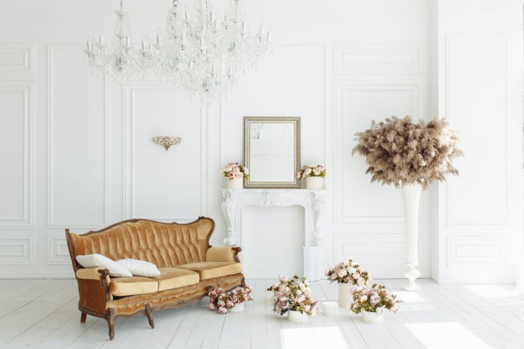 beautiful-classical-white-interior-with-fireplace-brown-sofa-vintage-chandelier